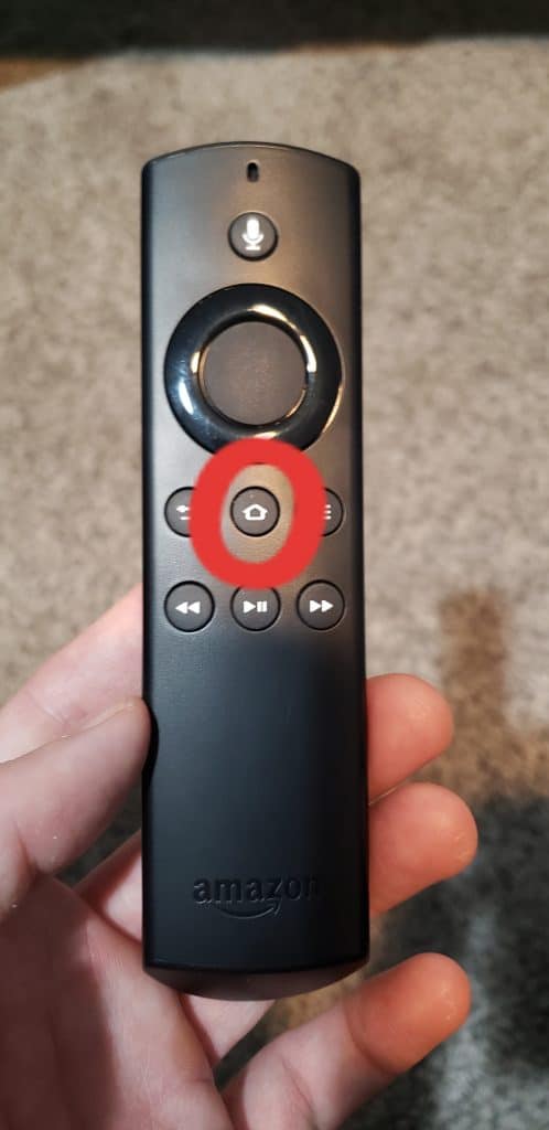 Click and hold "Home" on your Fire Stick remote.